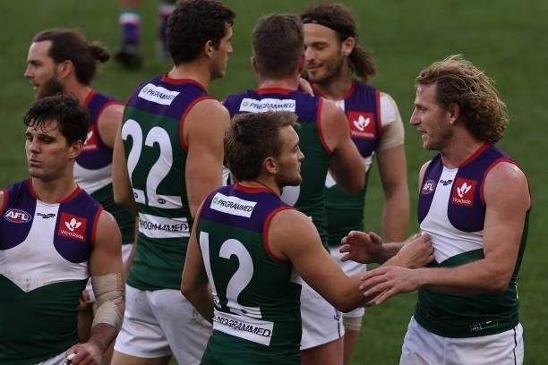 David Mundy of the Dockers talks with Mitchell Crowden while walking from the field at the half time break during the round 20 AFL match between...