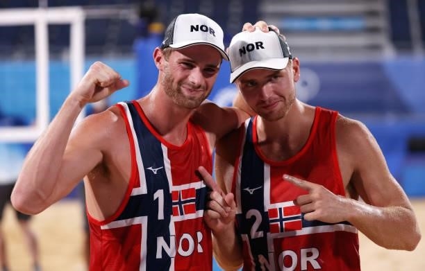 Anders Berntsen Mol and Christian Sandlie Sorum of Team Norway react after defeating Team Netherlands during the Men's Round of 16 beach volleyball...