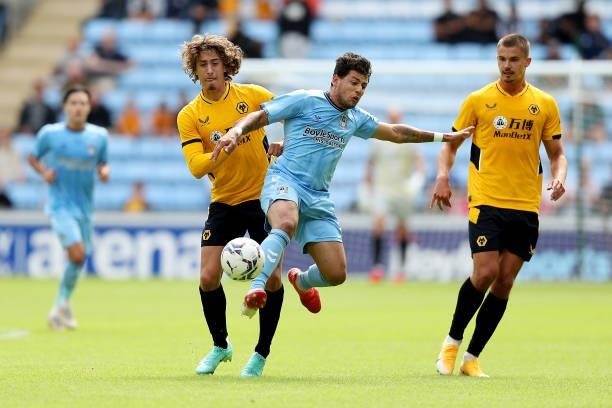 Fabio Silva of Wolverhampton Wanderers battles for possession against Gustavo Hamer of Coventry City during the Pre-Season Friendly between Coventry...