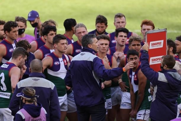 Justin Longmuir, head coach of the Dockers addresses his player at the quarter time break during the round 20 AFL match between Fremantle Dockers and...