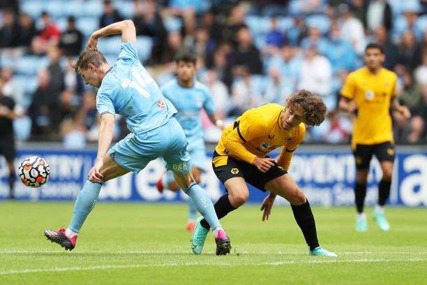 Fabio Silva of Wolverhampton Wanderers battles for possession against Ben Sheaf of Coventry City during the Pre-Season Friendly between Coventry City...