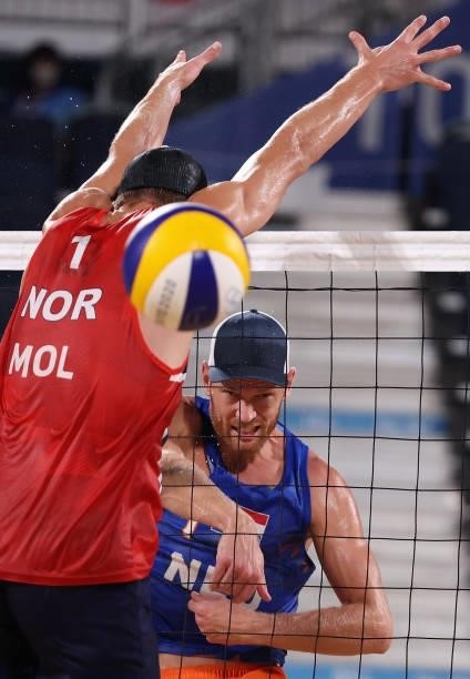 Alexander Brouwer of Team Netherlands competes against Anders Berntsen Mol of Team Norway during the Men's Round of 16 beach volleyball on day nine...