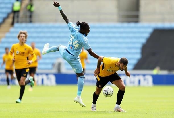 Patrick Cutrone of Wolverhampton Wanderers is challenged during the Pre-Season Friendly between Coventry City and Wolverhampton Wanderers at Ricoh...