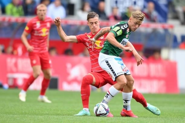 Luka Sucic of FC Red Bull Salzburg and Nikola Stosic of SV Ried compete for the ball during the Admiral Bundesliga match between FC Red Bull Salzburg...