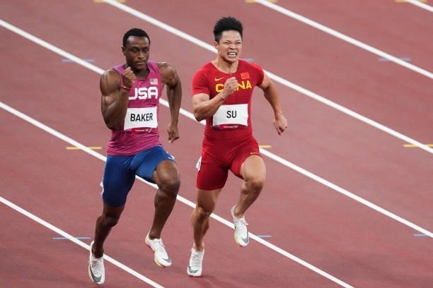 Ronnie Baker of United States and Su Bingtian of China compete in the Men's 100m Final on day nine of the Tokyo 2020 Olympic Games at Olympic Stadium...