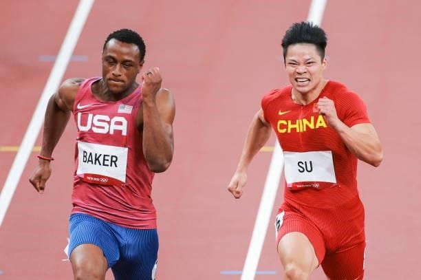 Ronnie Baker of United States and Su Bingtian of China compete in the Men's 100m Final on day nine of the Tokyo 2020 Olympic Games at Olympic Stadium...