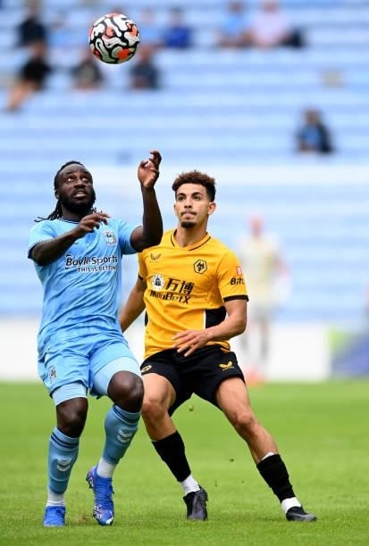 Frankaty Dabo of Coventry is challenged by Rayan Ait-Nouri of Wolverhampton during the Coventry City v Wolverhampton Wanderers pre-season friendly at...