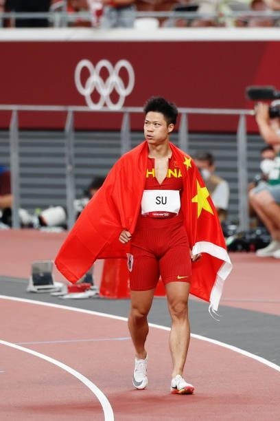 Su Bingtian of China reacts on the track after the Men's 100m Final on day nine of the Tokyo 2020 Olympic Games at Olympic Stadium on August 1, 2021...