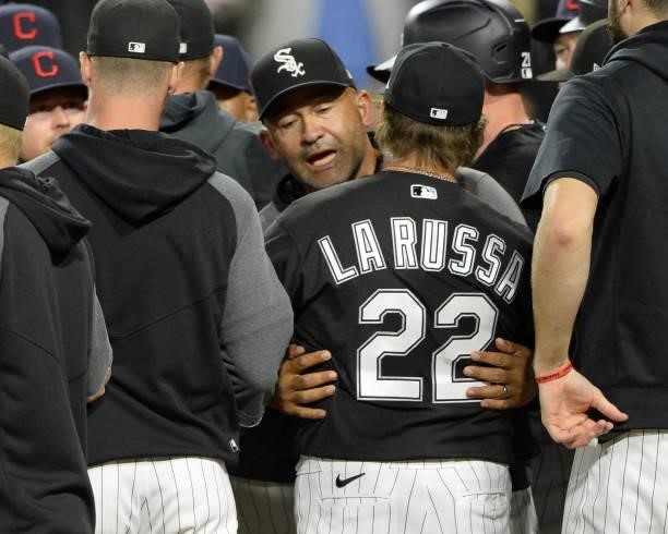 Manager Tony La Russa is held back by Bench Coach Miguel Cairo afterJose Abreu of the Chicago White Sox was hit in the helmet by a pitch from James...