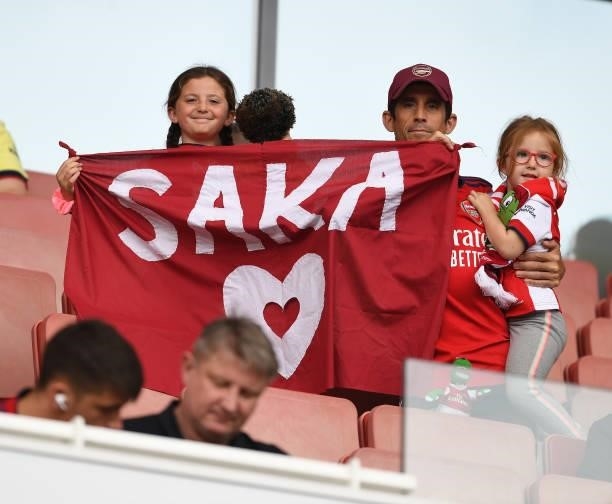 Arsenal fans show support to Bukayo Saka before the pre season friendly between Arsenal and Chelsea at Emirates Stadium on August 01, 2021 in London,...