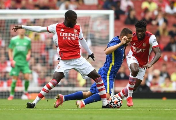 Nicolas Pepe and Thomas Partey challenge Mateo Kovacic of Chelsea of Arsenal during the pre season friendly between Arsenal and Chelsea at Emirates...