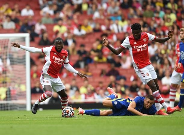 Nicolas Pepe and Thomas Partey challenge Mateo Kovacic of Chelsea of Arsenal during the pre season friendly between Arsenal and Chelsea at Emirates...