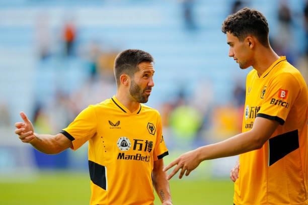Joao Moutinho of Wolverhampton Wanderers talks to Max Kilman during the Pre-Season Friendly between Coventry City and Wolverhampton Wanderers at...