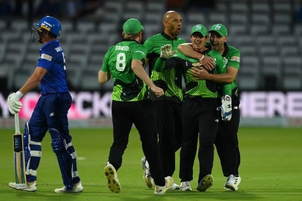 Quinton de Kock of Southern Brave celebrates with team mates after running out Mohammad Nabi of London Spirit during The Hundred match between London...