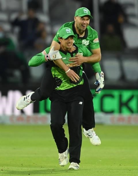 Quinton de Kock and Jake Lintott of Southern Brave celebrate after the run out of Blake Cullen of London Spirit during The Hundred match between...