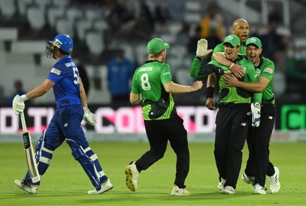 Quinton de Kock, Jake Lintott and Tymal Mills of Southern Brave celebrate after the run out of Blake Cullen of London Spirit during The Hundred match...
