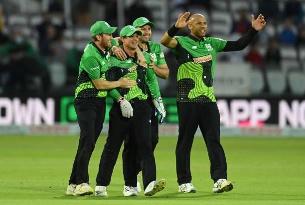 Liam Dawson, Quinton de Kock, Jake Lintott and Tymal Mills of Southern Brave celebrate after the run out of Blake Cullen of London Spirit during The...