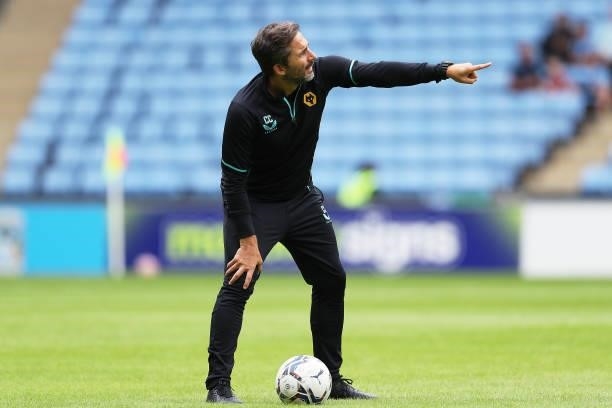Carlos Cachada, First-team fitness coach of Wolverhampton Wanderers gives instructions ahead of the Pre-Season Friendly between Coventry City and...