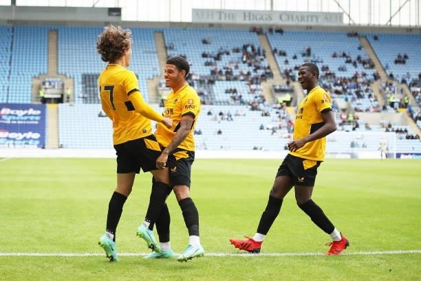 Fabio Silva of Wolverhampton Wanderers celebrates scoring his team's first goal with Morgan Gibbs-White and Yerson Mosquera during the Pre-Season...