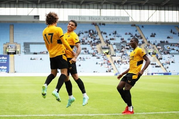 Fabio Silva of Wolverhampton Wanderers celebrates scoring his team's first goal with Morgan Gibbs-White and Yerson Mosquera during the Pre-Season...
