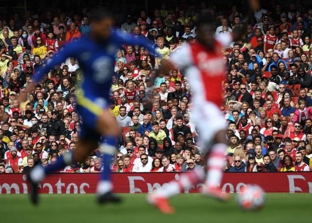 Arsenal fan watch the pre season friendly between Arsenal and Chelsea at Emirates Stadium on August 01, 2021 in London, England.