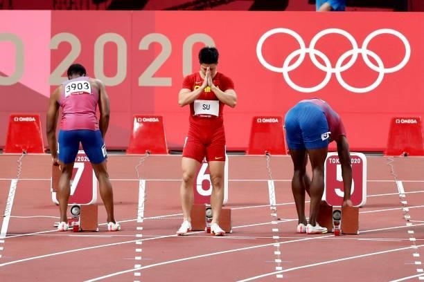 Fred Kerley of United States, Su Bingtian of China, Ronnie Baker of United States prepare in the Men's 100 m final on day nine of the Tokyo 2020...