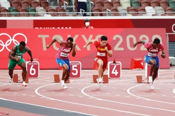 Fred Kerley of United States, Su Bingtian of China, Ronnie Baker of United States, Enoch Adegoke of Nigeria compete in the Men's 100 m final on day...