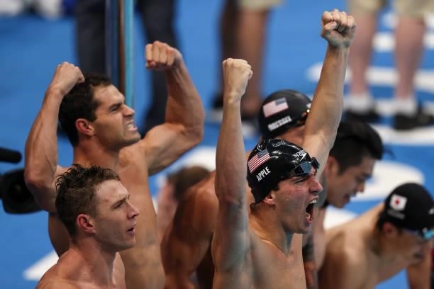 Gold medalists Ryan Murphy, Michael Andrew, Caeleb Dressel and Zach Apple of Team United States celebrate after breaking the world record and winning...