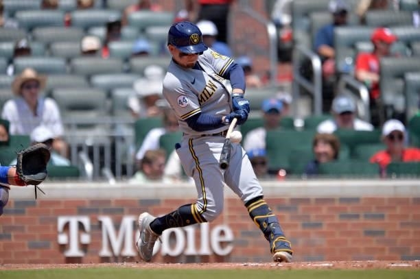 Luis Urías of the Milwaukee Brewers bats during a game against the Atlanta Braves at Truist Park on August 1, 2021 in Atlanta, Georgia.