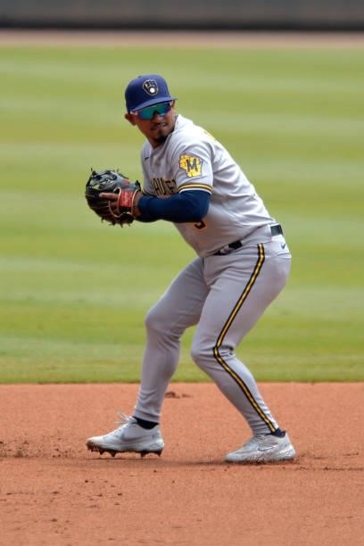 Eduardo Escobar of the Milwaukee Brewers fields a ground ball during a game against the Atlanta Braves at Truist Park on August 1, 2021 in Atlanta,...
