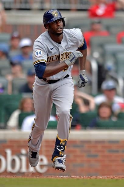 Lorenzo Cain of the Milwaukee Brewers runs to first base during a game against the Atlanta Braves at Truist Park on August 1, 2021 in Atlanta,...