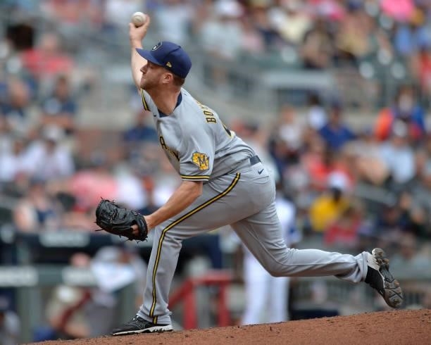 Brad Boxberger of the Milwaukee Brewers pitches against the Atlanta Braves at Truist Park on August 1, 2021 in Atlanta, Georgia.