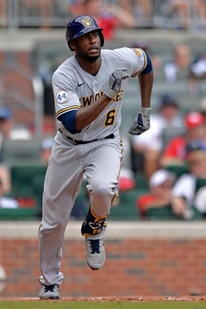 Lorenzo Cain of the Milwaukee Brewers runs to first base during a game against the Atlanta Braves at Truist Park on August 1, 2021 in Atlanta,...