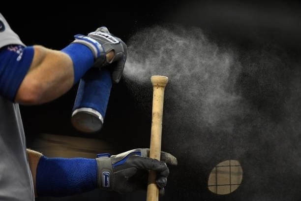 Justin Turner of the Los Angeles Dodgers prepares his bat prior to stepping into the batters box against the Arizona Diamondbacks at Chase Field on...