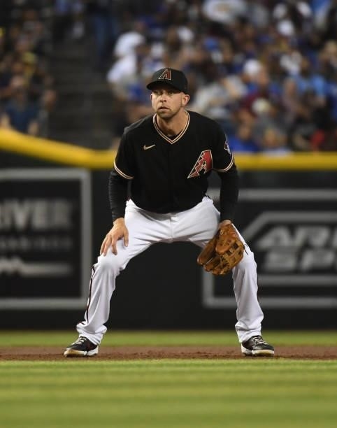Drew Ellis of the Arizona Diamondbacks gets ready to make a play at third base against the Los Angeles Dodgers at Chase Field on July 31, 2021 in...
