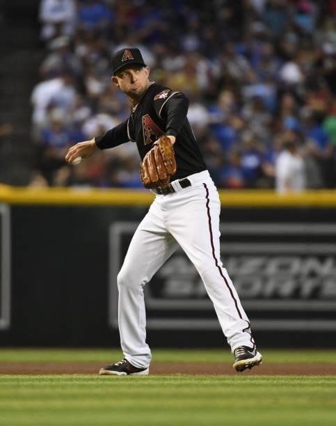 Drew Ellis of the Arizona Diamondbacks makes a throw to first base against the Los Angeles Dodgers at Chase Field on July 31, 2021 in Phoenix,...