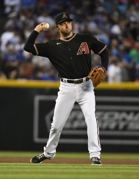 Drew Ellis of the Arizona Diamondbacks makes a throw to first base against the Los Angeles Dodgers at Chase Field on July 31, 2021 in Phoenix,...