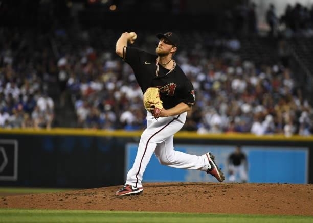 Merrill Kelly of the Arizona Diamondbacks delivers a pitch against the Los Angeles Dodgers at Chase Field on July 31, 2021 in Phoenix, Arizona.