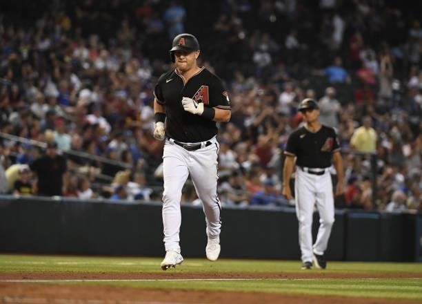 Kole Calhoun of the Arizona Diamondbacks rounds the bases after hitting a home run against the Los Angeles Dodgers at Chase Field on July 31, 2021 in...