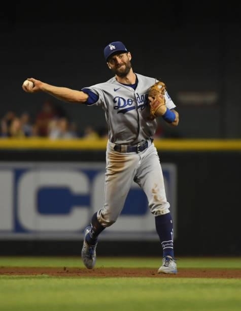 Chris Taylor of the Los Angeles Dodgers throws the ball to first base against the Arizona Diamondbacks at Chase Field on July 31, 2021 in Phoenix,...