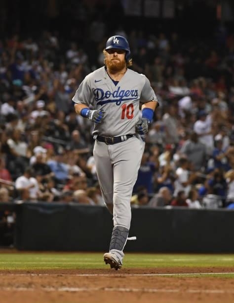 Justin Turner of the Los Angeles Dodgers rounds the bases after hitting a two run home run off of Stefan Crichton of the Arizona Diamondbacks during...