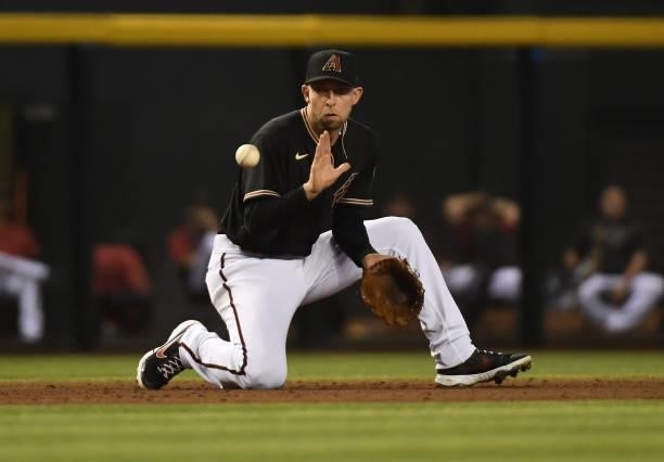 Drew Ellis of the Arizona Diamondbacks makes a play on a ground ball against the Los Angeles Dodgers at Chase Field on July 31, 2021 in Phoenix,...
