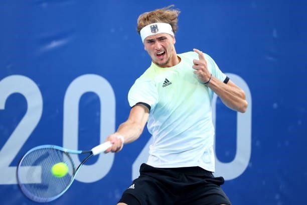 Alexander Zverev of Team Germany hits a forehand against Karen Khachanov of Team Russian Olympic Committee during the Men's Singles Gold Medal Match...