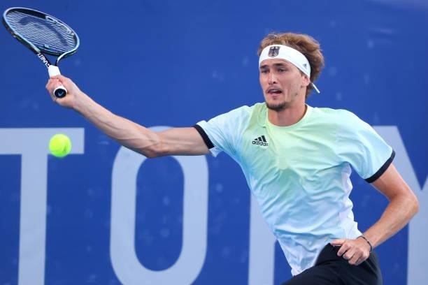 Alexander Zverev of Team Germany hits a forehand against Karen Khachanov of Team Russian Olympic Committee during the Men's Singles Gold Medal Match...