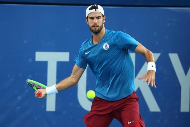 Karen Khachanov of Team Russian Olympic Committee hits a forehand against Alexander Zverev of Team Germany during the Men's Singles Gold Medal Match...