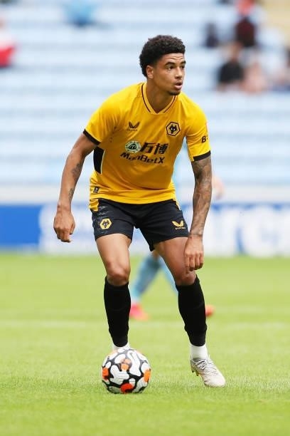 Ki-Jana Hoever of Wolverhampton Wanderers runs with the ball during the Pre-Season Friendly between Coventry City and Wolverhampton Wanderers at...