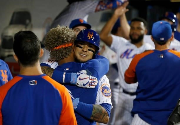 Javier Baez of the New York Mets celebrates his sixth inning two run home run against the Cincinnati Reds with teammate Francisco Lindor at Citi...