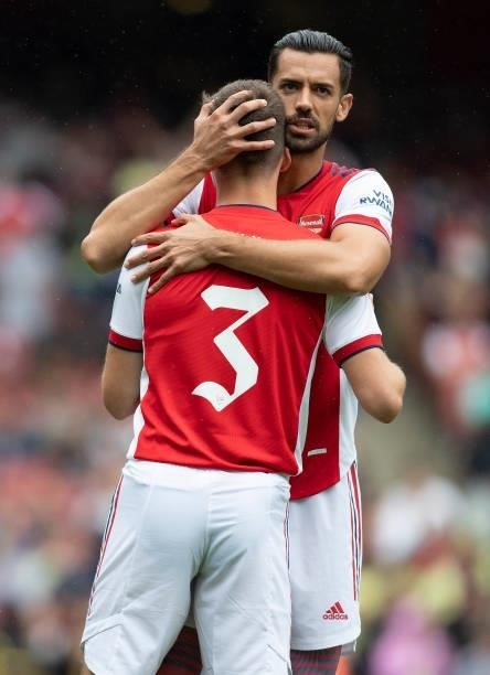 Pablo Marí of Arsenal gives Kieran Tierney a hug during the Pre Season Friendly between Arsenal and Chelsea at Emirates Stadium on August 1, 2021 in...
