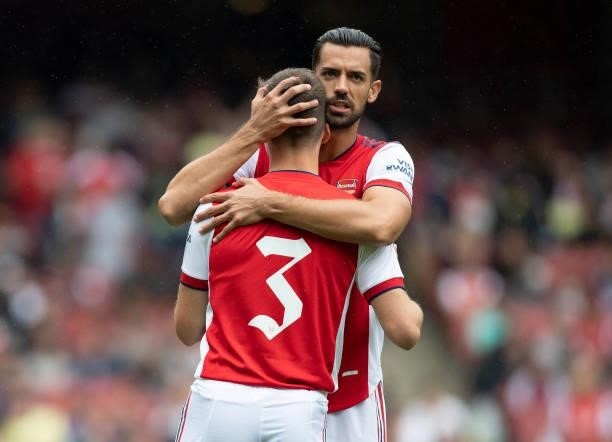 Pablo Marí of Arsenal gives Kieran Tierney a hug during the Pre Season Friendly between Arsenal and Chelsea at Emirates Stadium on August 1, 2021 in...