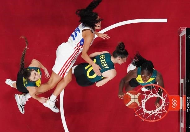 Ezi Magbegor, Katie Ebzery and Tess Lavey of Team Australia fight for possession of a rebound with Isalys Quinones of Team Puerto Rico during the...